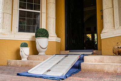 a ramp with cloth protection underneath to protect the stairs